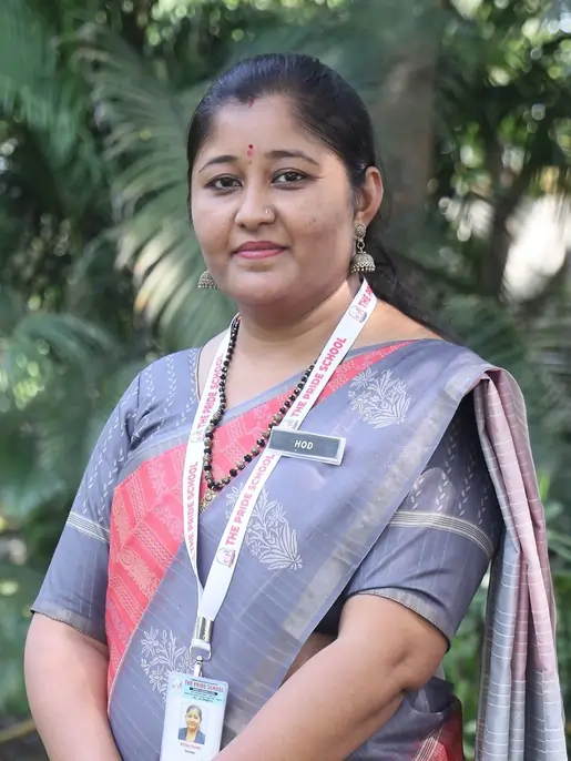 A teacher from Pride School, exemplifying dedication and commitment to quality education and mentoring students.